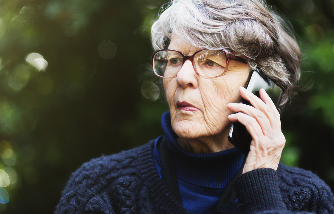 senior lady on the phone looking confused